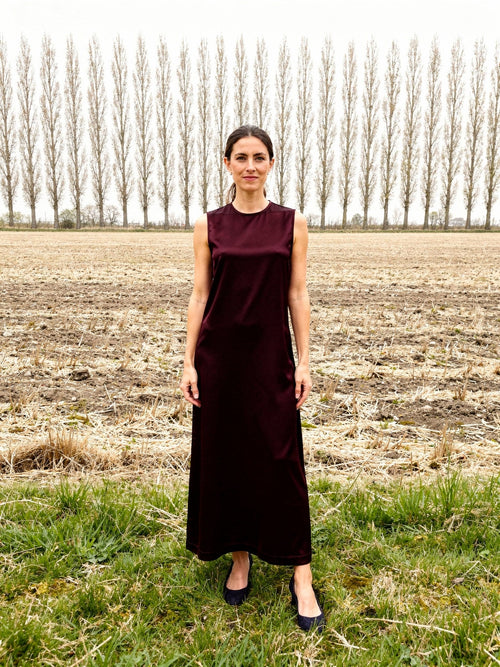Burgundy dress in Claret satin, sleeveless ankle length column, worn front view