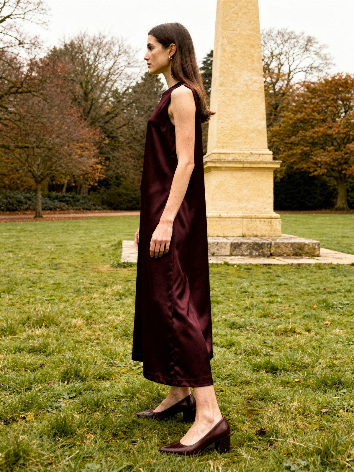 Burgundy dress in Claret satin, side profile showing the ankle length column