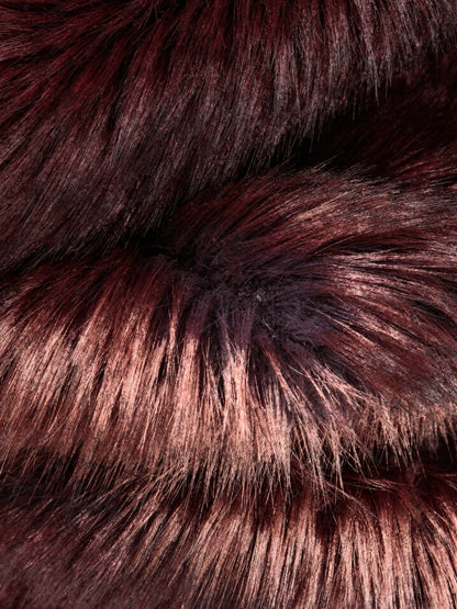 Close up of the long burgundy faux fur pile with its paler tips