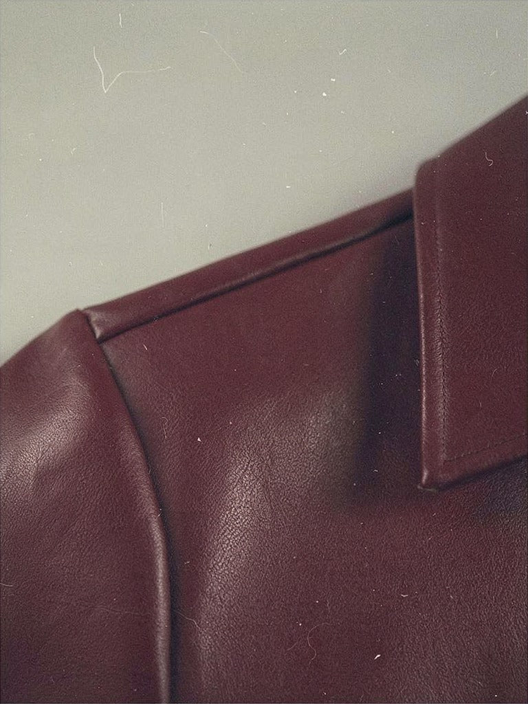 Close-up of the smooth faux leather and shoulder seam in Morello