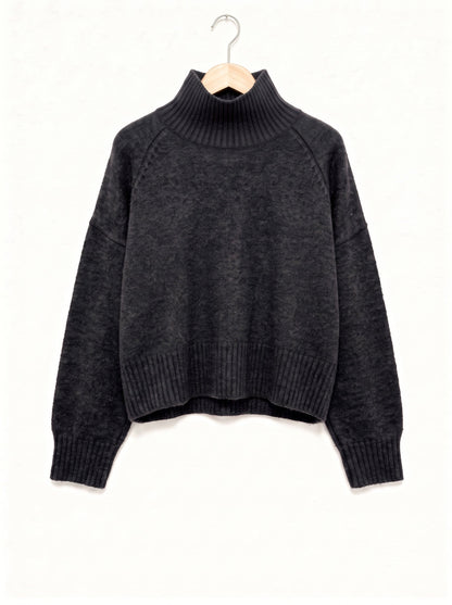 Fawsley jumper in charcoal marl knit, ribbed funnel neck and raglan sleeves, on a wooden hanger