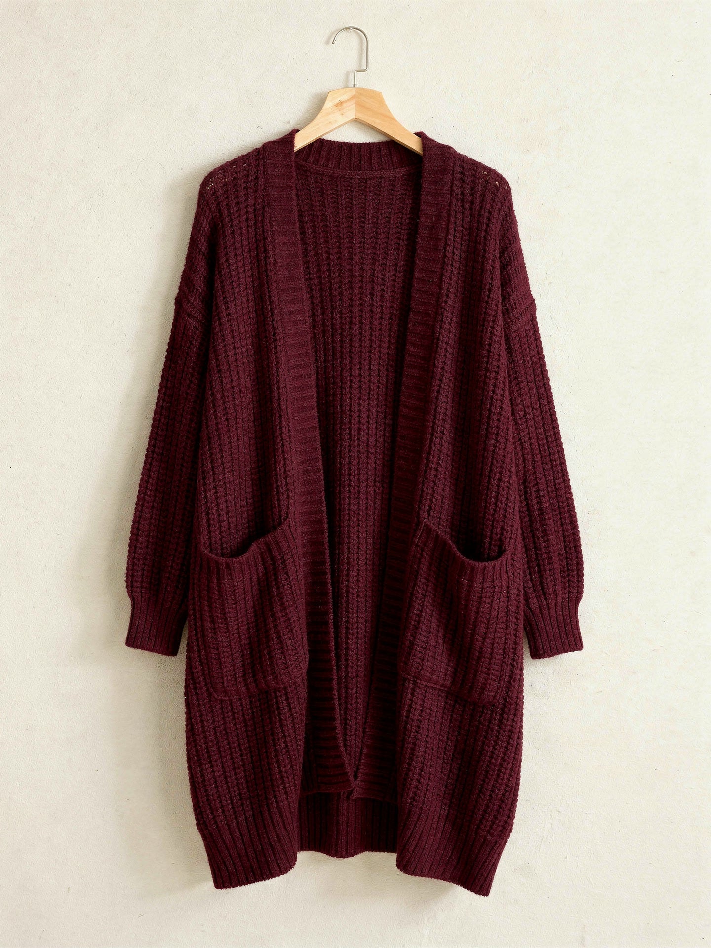Burgundy longline open front chunky rib cardigan on a hanger
