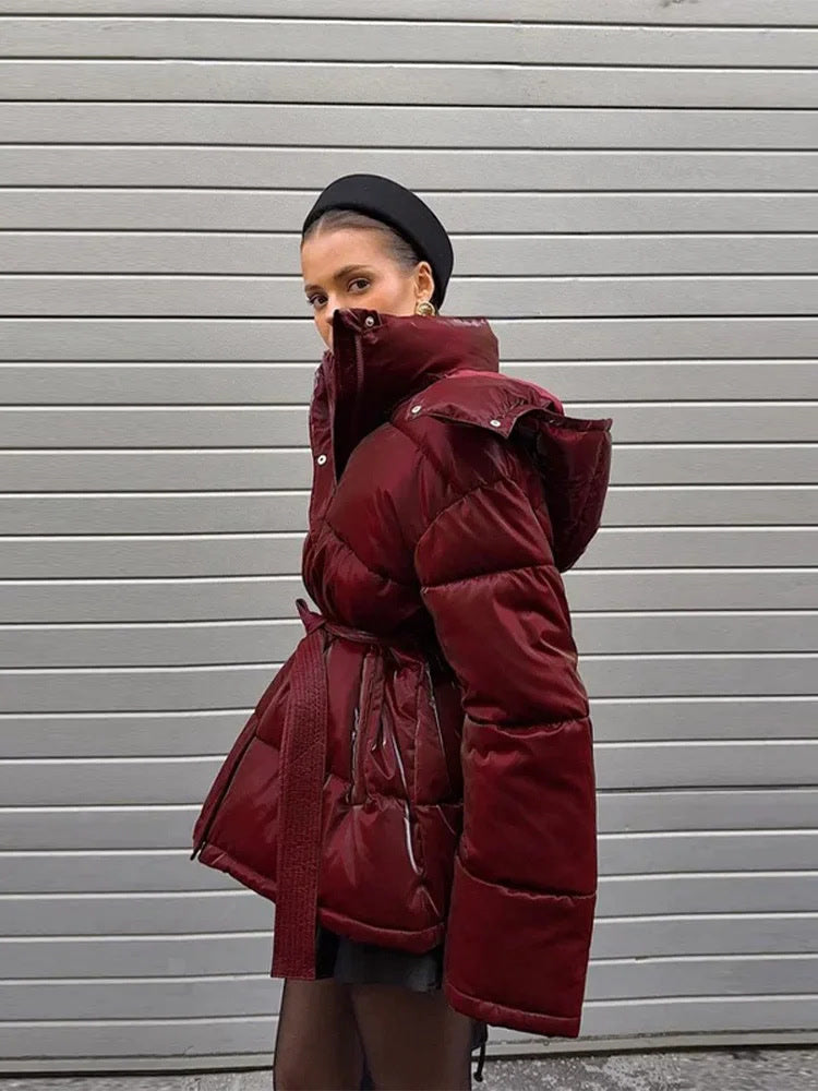 Burgundy puffer jacket in Rioja, collar up, worn outdoors