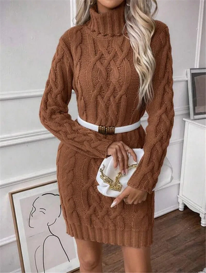 The caramel brown cable-knit jumper dress styled with a slim white belt