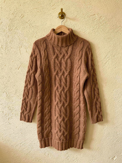 Caramel brown cable-knit roll-neck jumper dress on a wooden hanger