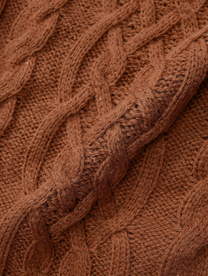 Close-up of the chunky rope cable texture of the caramel brown knitted dress
