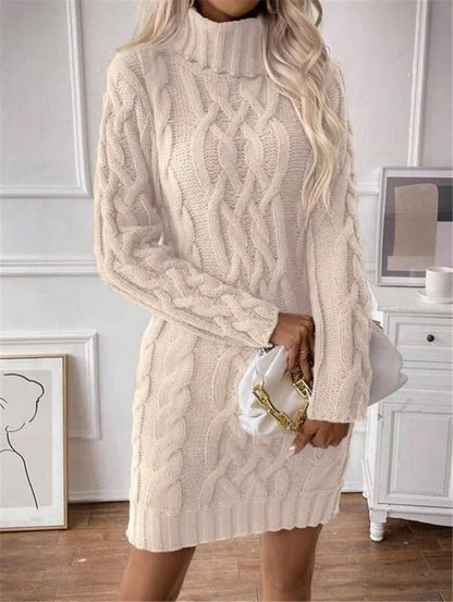 Front view of the cream cable-knit roll-neck jumper dress worn