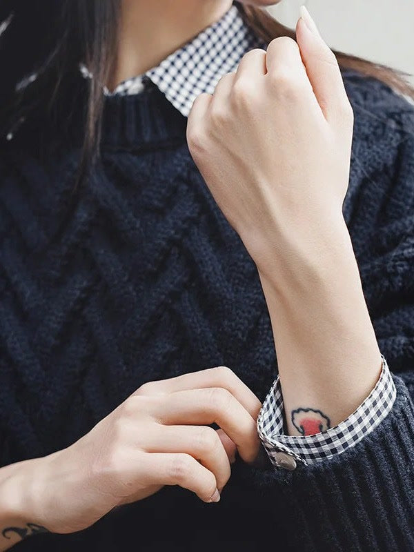 Deep ribbed cuff and chevron cable detail on the Ink Blue cable knit jumper