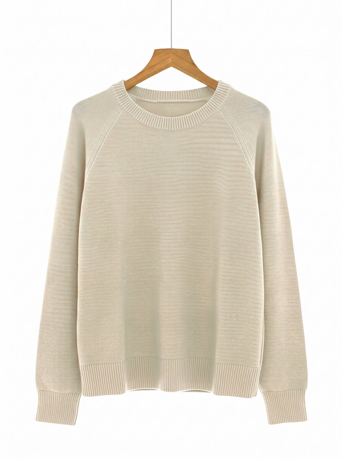 The Avington camel jumper in Calico on a wooden hanger