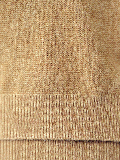 Close up of the fine spun knit and ribbed cuff of the Avington camel jumper
