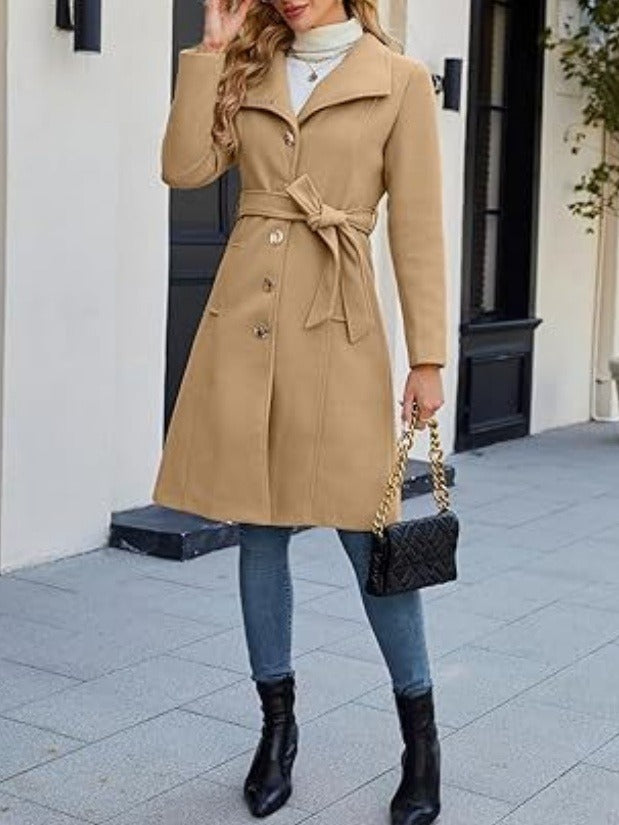Camel overcoat worn with the belt tied at the waist
