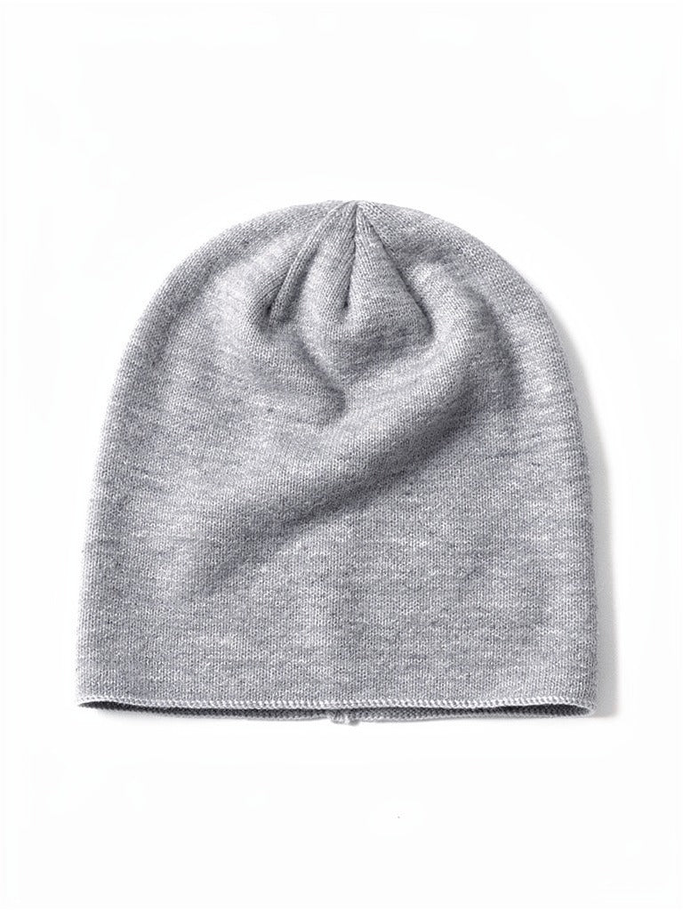 Grey cashmere beanie, front view, showing the fine plain knit and single chained edge