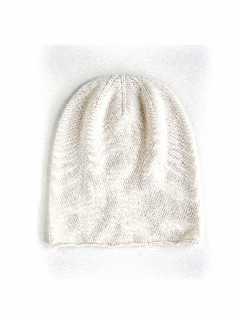 Off-white cashmere beanie in Linen, front view, plain knit with no ribbed band