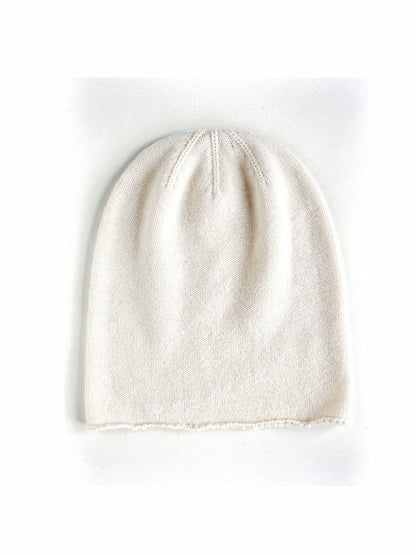Off-white cashmere beanie in Linen, front view, plain knit with no ribbed band