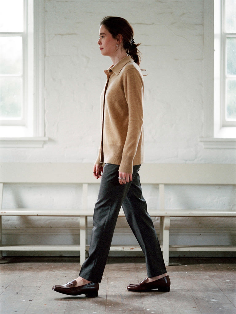 Womens cashmere cardigan in Fawn worn buttoned over charcoal trousers