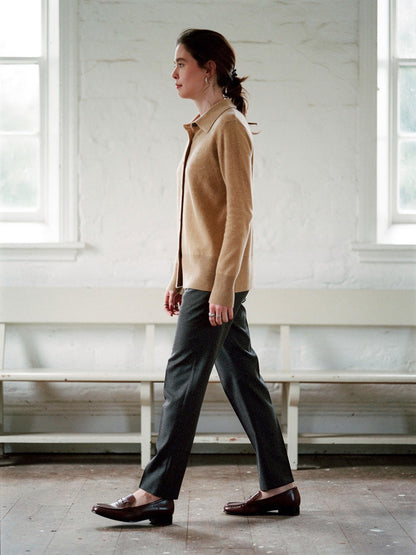 Womens cashmere cardigan in Fawn worn buttoned over charcoal trousers