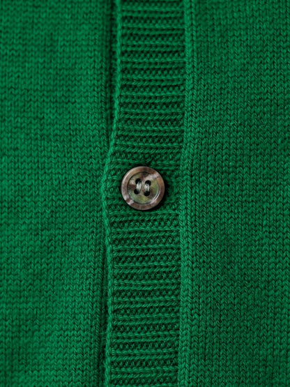 Close-up of the fine wool and cashmere knit and horn button of the cardigan