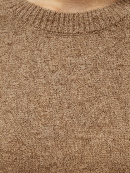 Close-up of the fine cashmere knit and ribbed crew neckline