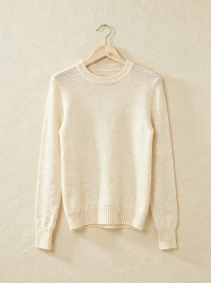 Winter white cashmere crew-neck jumper on a wooden hanger