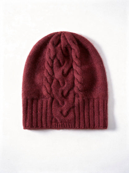 Burgundy cashmere hat with a plaited cable panel running down through the ribbed band