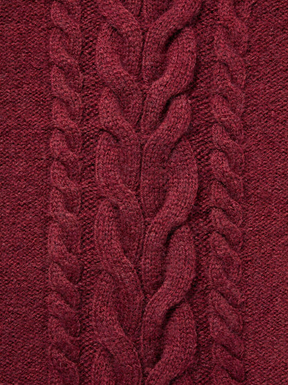 Close view of the plaited cable panel and rope twists on a burgundy cashmere hat