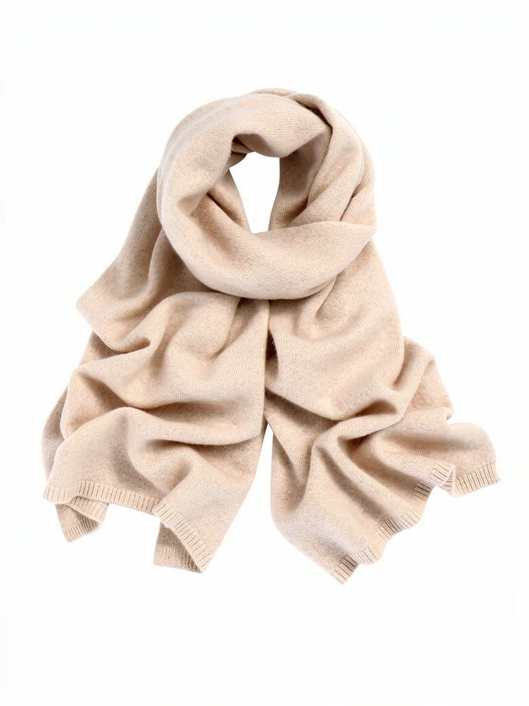 Barley cashmere scarf laid flat and coiled on a white background