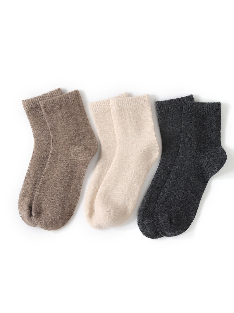 Cashmere socks shown flat in three of the four colourways, Biscuit, Oatmeal and Charcoal