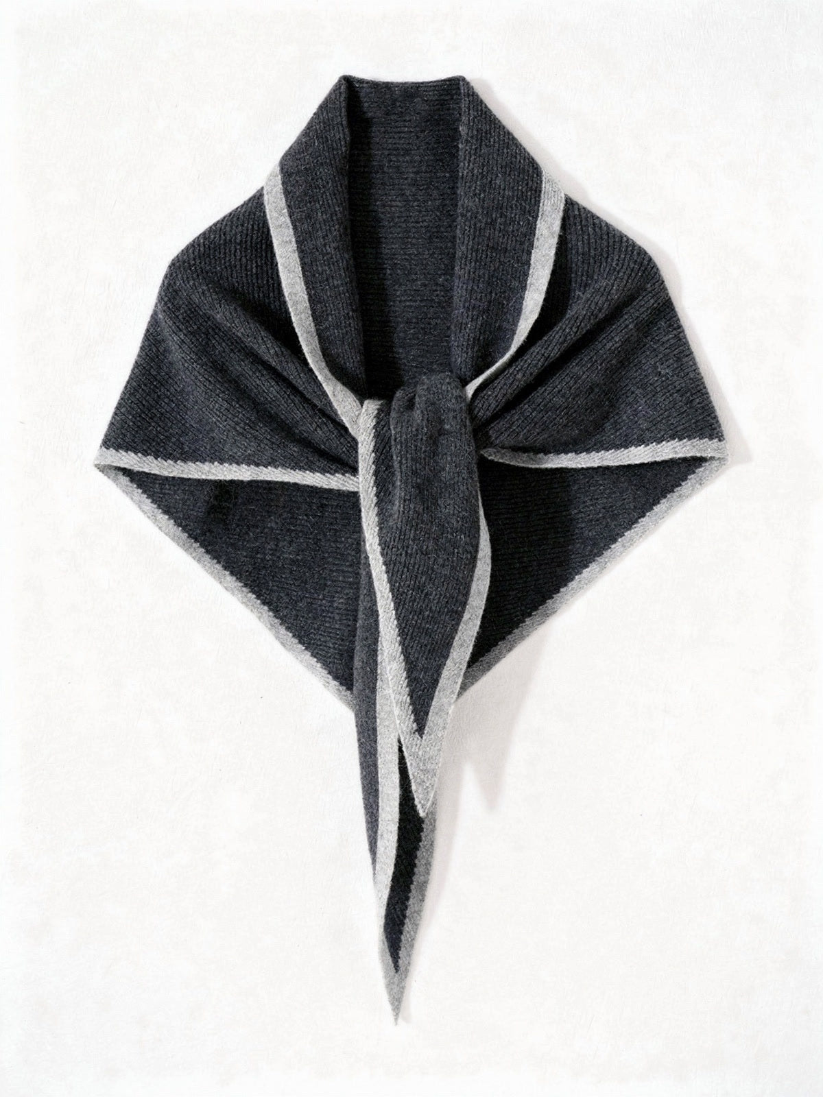 Cashmere triangle scarf in Cobblestone, knotted, showing the pale grey knitted contrast edge