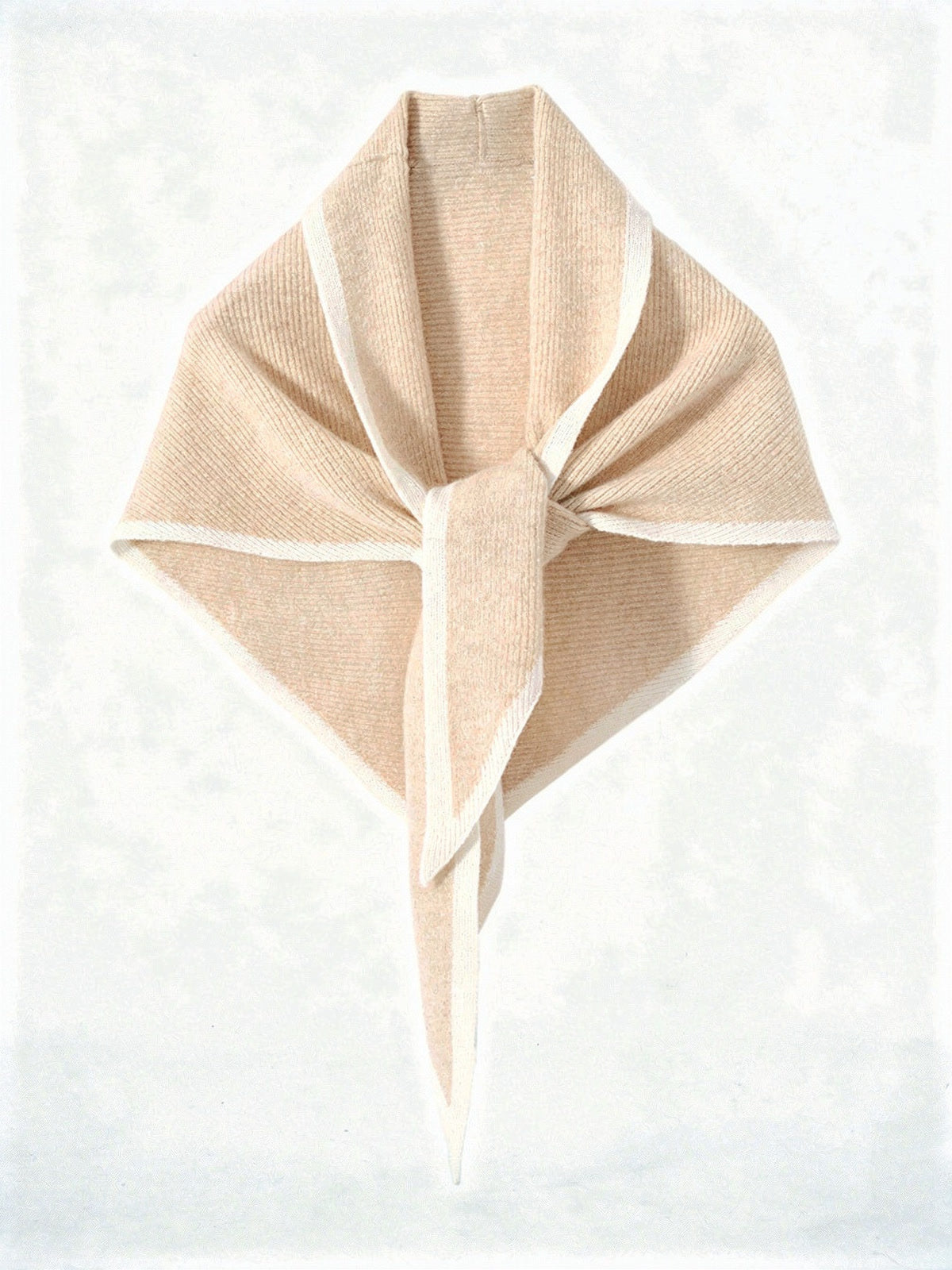 Cashmere triangle scarf in Hawthorn, knotted, showing the knitted contrast edge