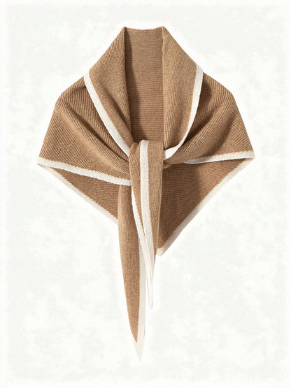 Cashmere triangle scarf in Sedge, knotted, showing the knitted contrast edge