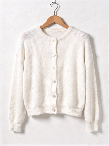 Chalk white button-through cardigan in brushed knit on a wooden hanger