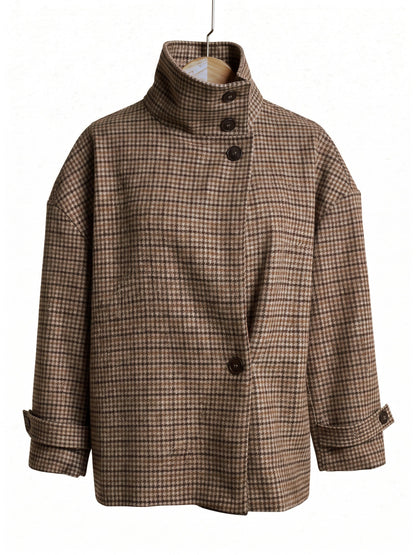 Check jacket in Russet houndstooth on a hanger, showing the tall funnel collar and the off centre row of four buttons