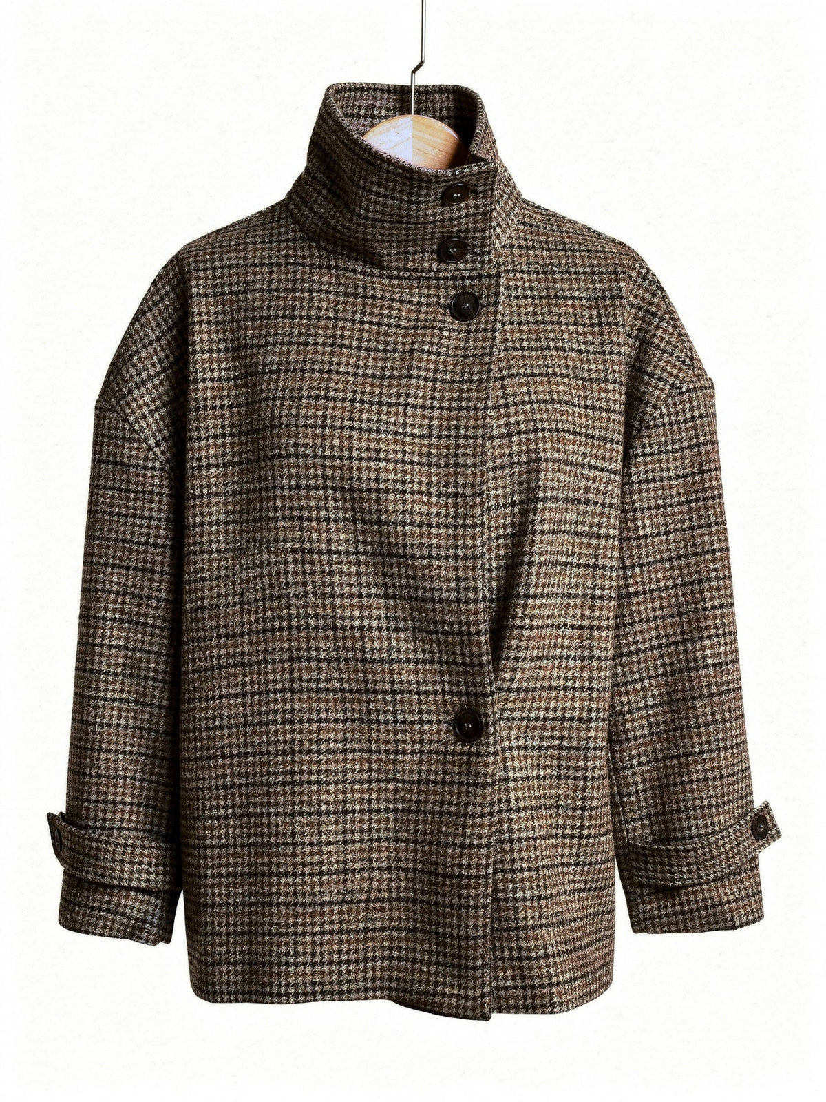 Check jacket in Sepia houndstooth on a hanger, showing the tall funnel collar and the crossover front