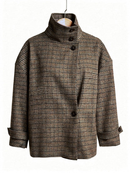 Check jacket in Sepia houndstooth on a hanger, showing the tall funnel collar and the crossover front