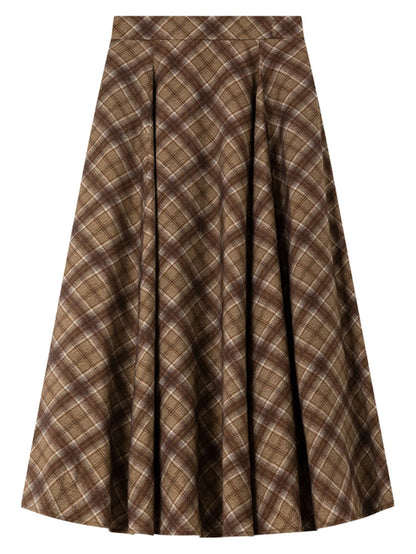 Checked pleated skirt laid flat from the front, showing the two pleats and the diagonal check