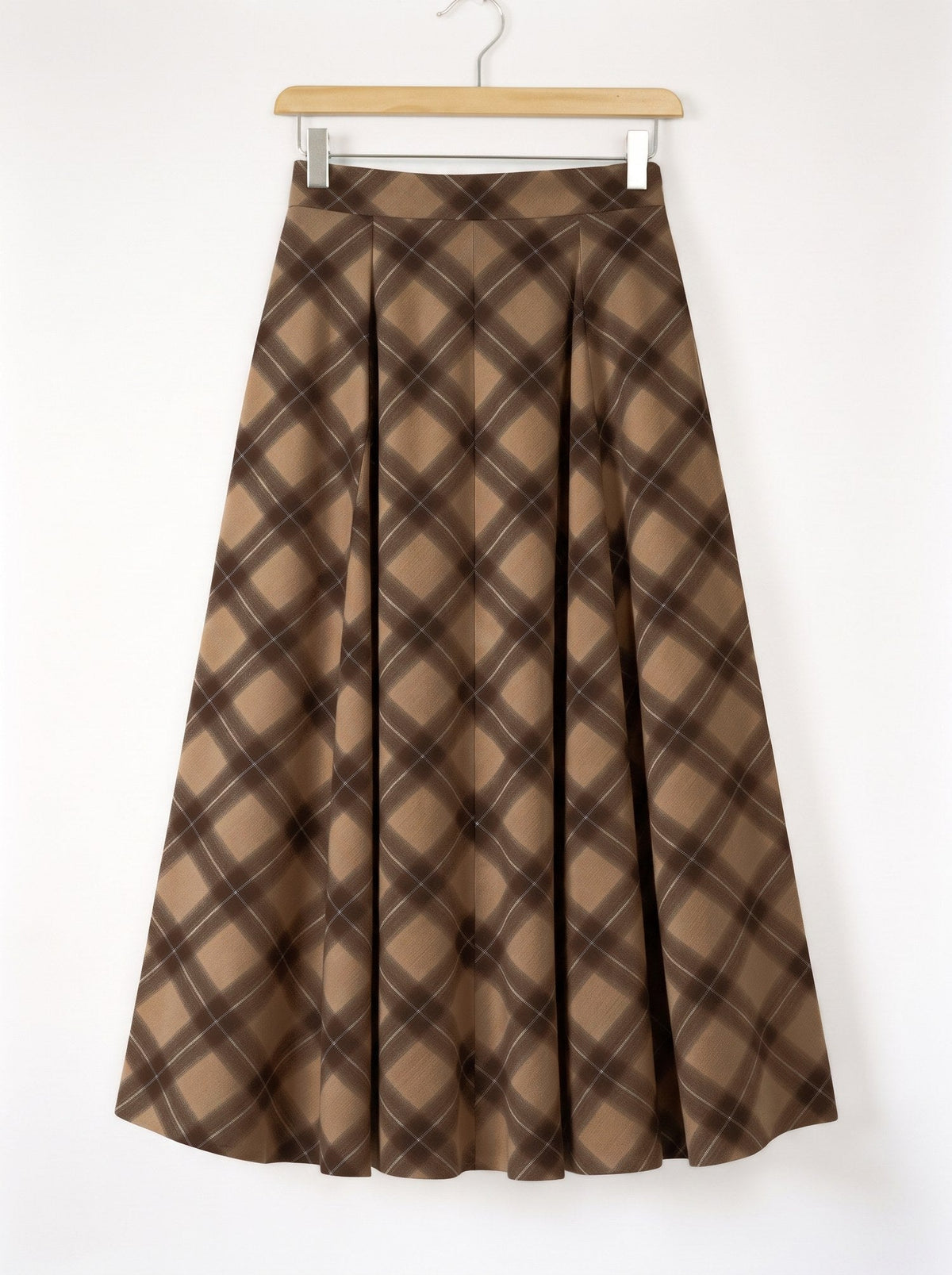 Checked pleated skirt on a hanger, showing the flat waistband and the two front pleats