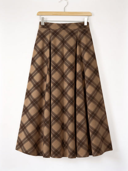 Checked pleated skirt on a hanger, showing the flat waistband and the two front pleats