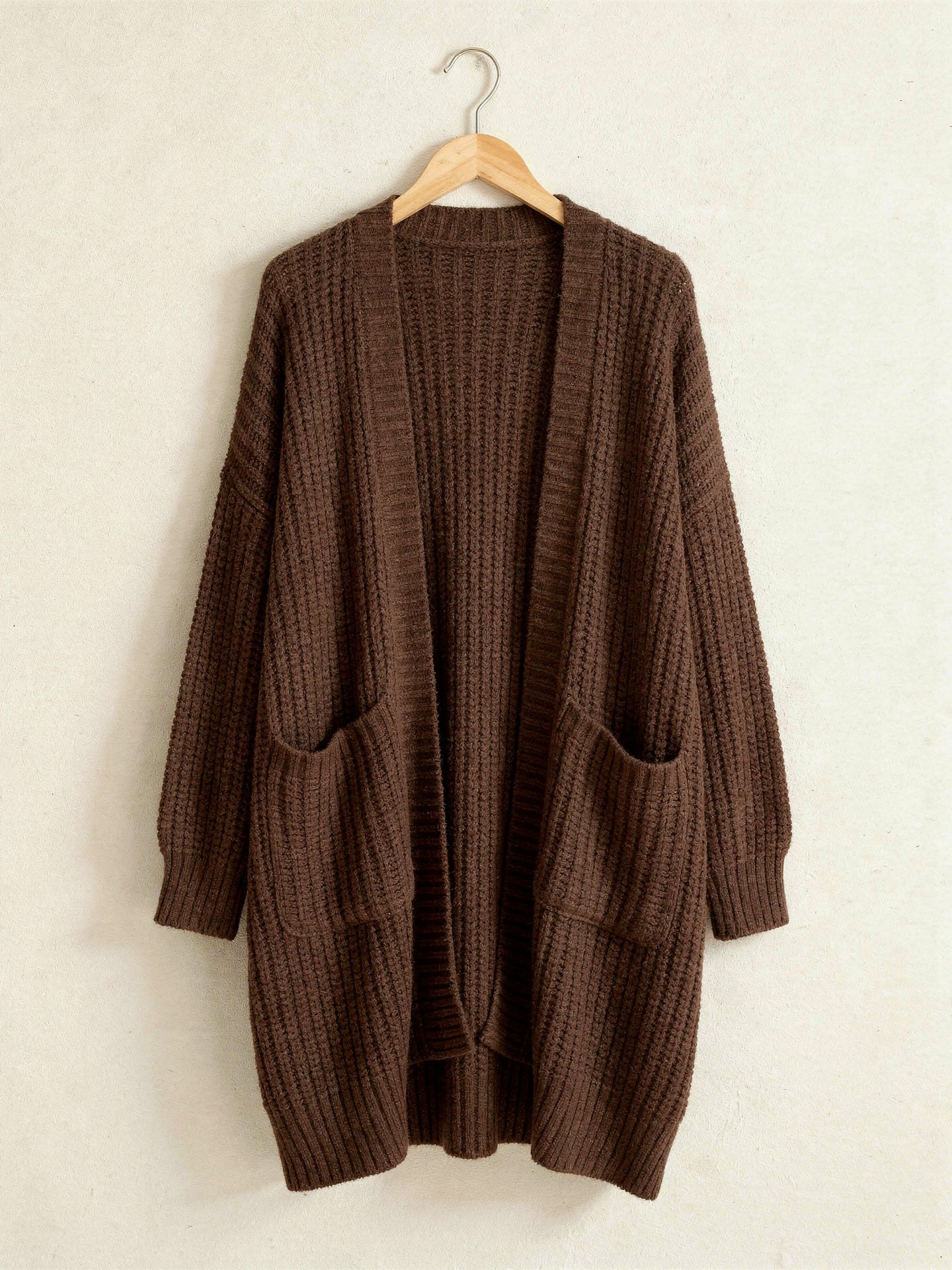 Chocolate brown longline open front chunky rib cardigan on a hanger