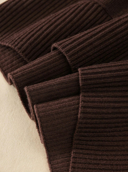 Close-up of the chunky ribbed knit texture of the oversized roll neck jumper