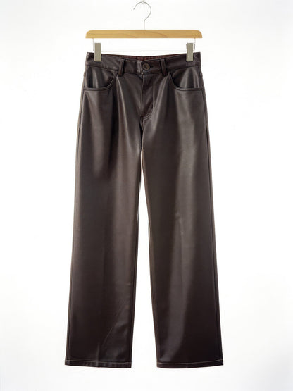 Coffee faux leather trousers, front view on a hanger
