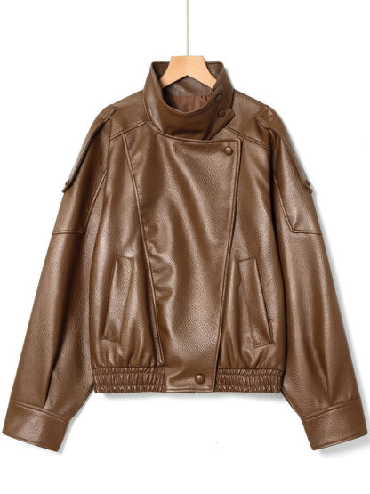 Cognac tan faux leather jacket with stand collar on a hanger