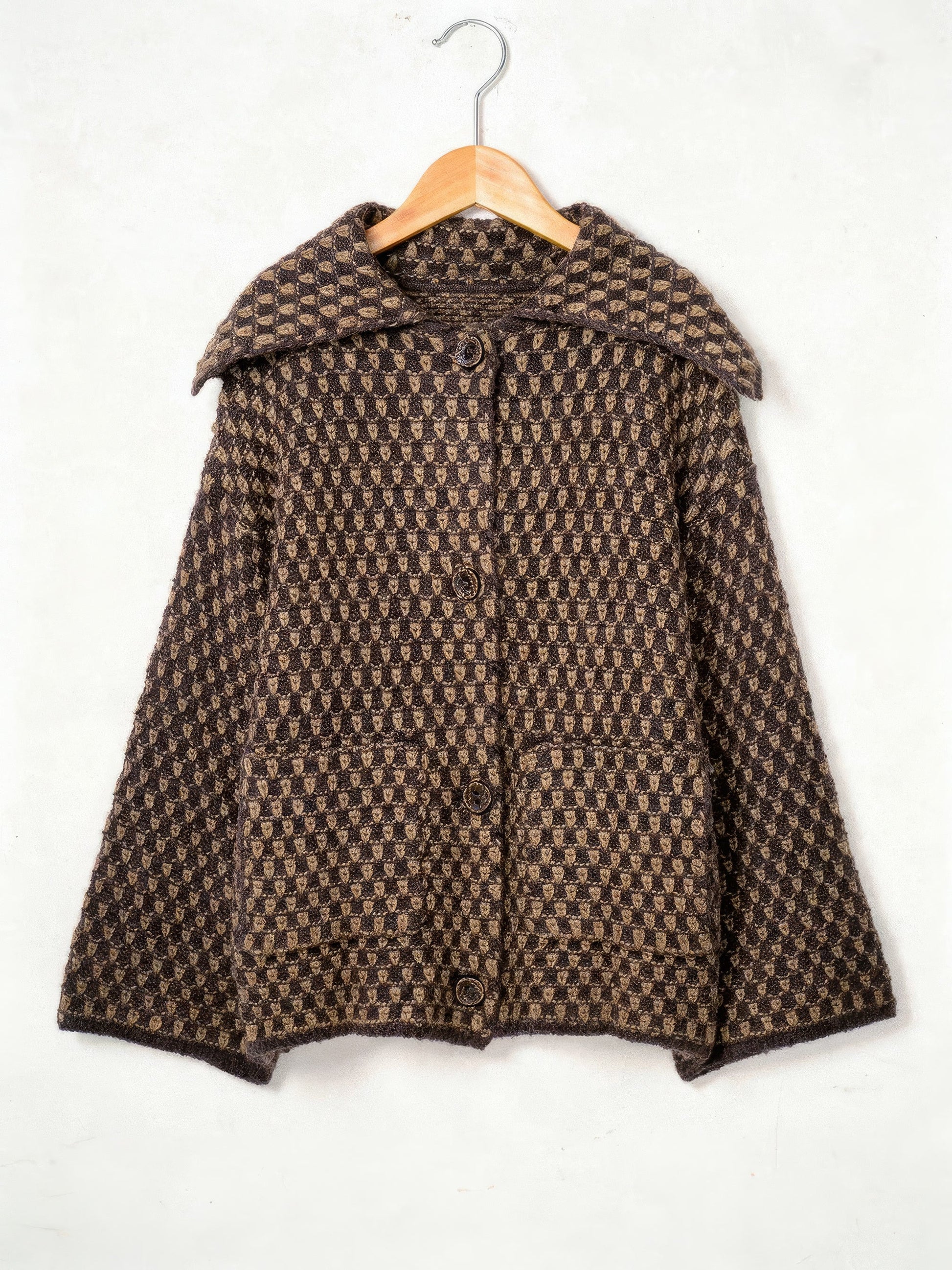Cocoa brown collared cardigan in chunky two-tone honeycomb knit on a wooden hanger