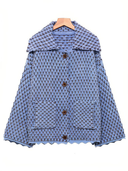 Cornflower blue collared cardigan in chunky two-tone knit on a wooden hanger