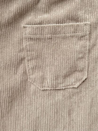 Close-up of the mid-wale corduroy and the stitched edge of a patch pocket