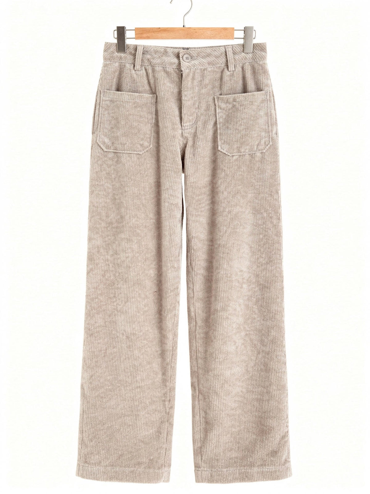 Cord trousers in Wheaten, front view on a wooden hanger, showing the two front patch pockets