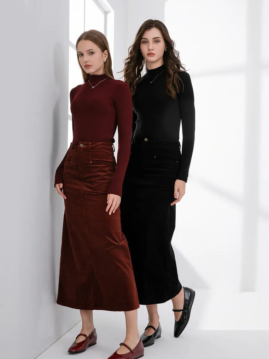 The corduroy skirt photographed by the maker in both colourways we sell, Amarone burgundy and Sloe black, shown full length