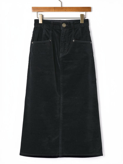 Corduroy skirt in Sloe black on a wooden hanger, front view, showing the angled rivet pockets, the antique brass button and the belt loops