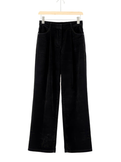 Corduroy wide-leg trousers in Black, front view on a wooden hanger