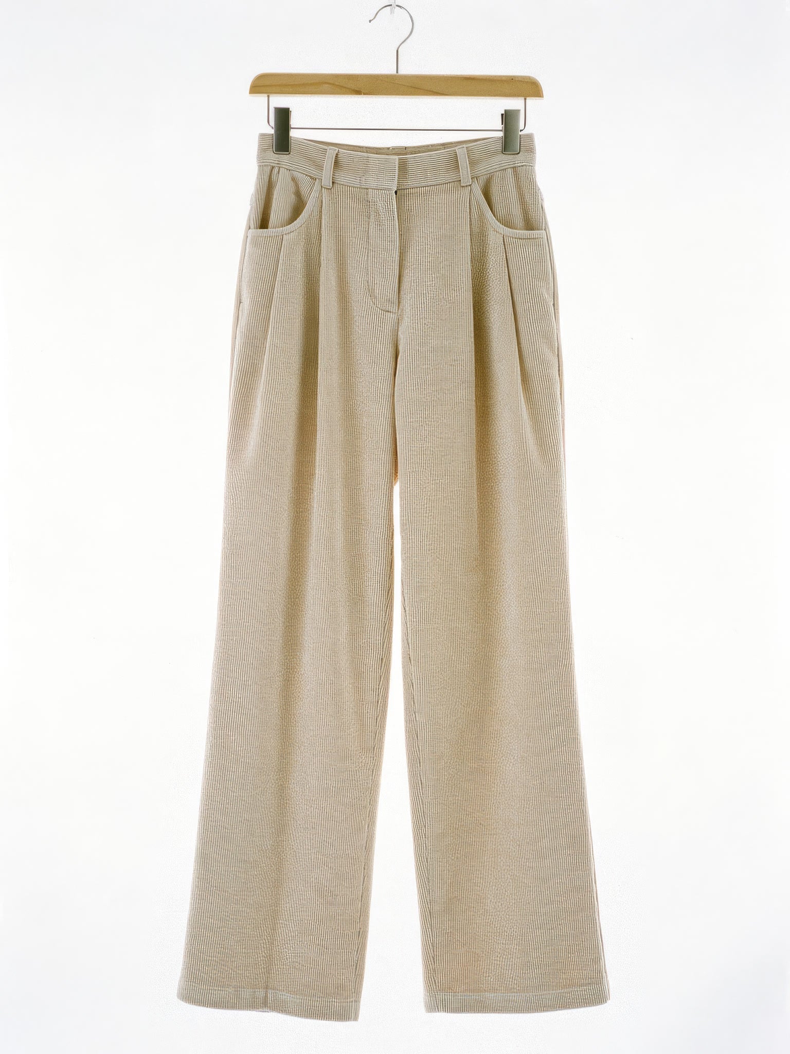 Corduroy wide-leg trousers in Parchment, front view on a wooden hanger