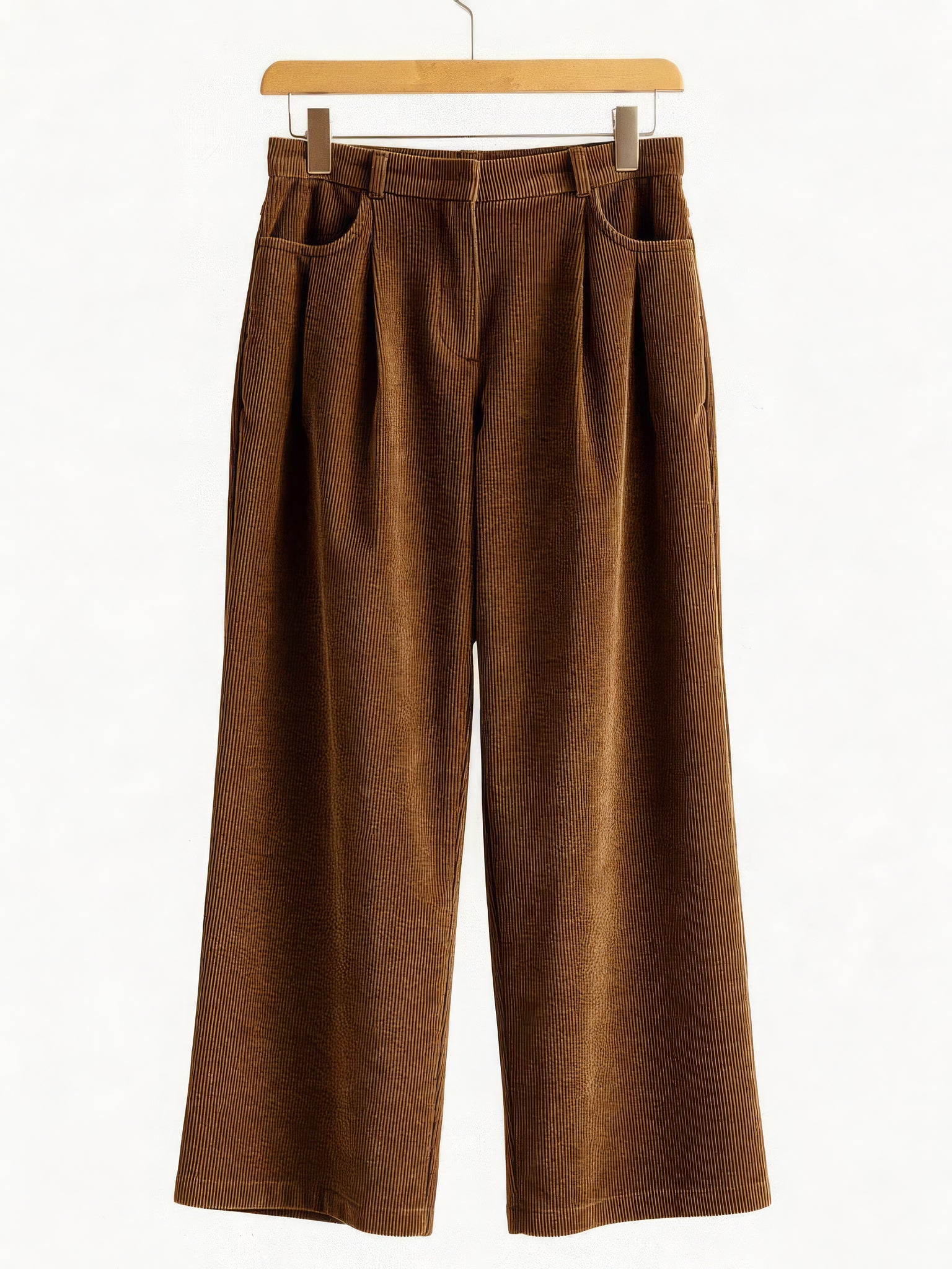 Corduroy wide-leg trousers in Tobacco, front view on a wooden hanger